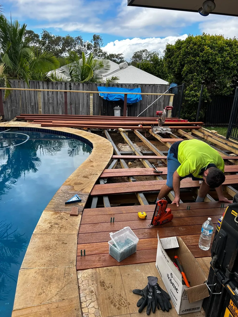 Before: deck subframe and first boards going down beside the pool
