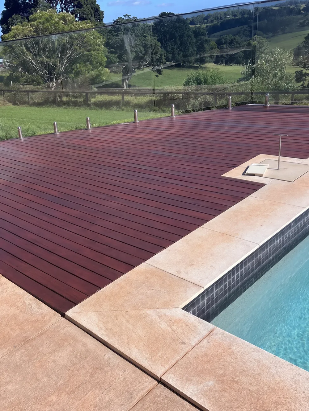 After (illustration): pool deck cleaned, sanded and recoated a deep red-brown