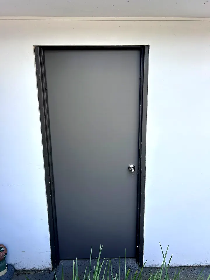 Charcoal door, hung and trimmed