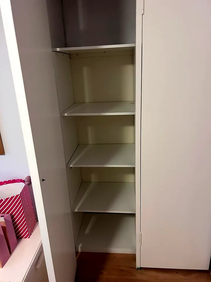 Shelving fitted inside a cupboard