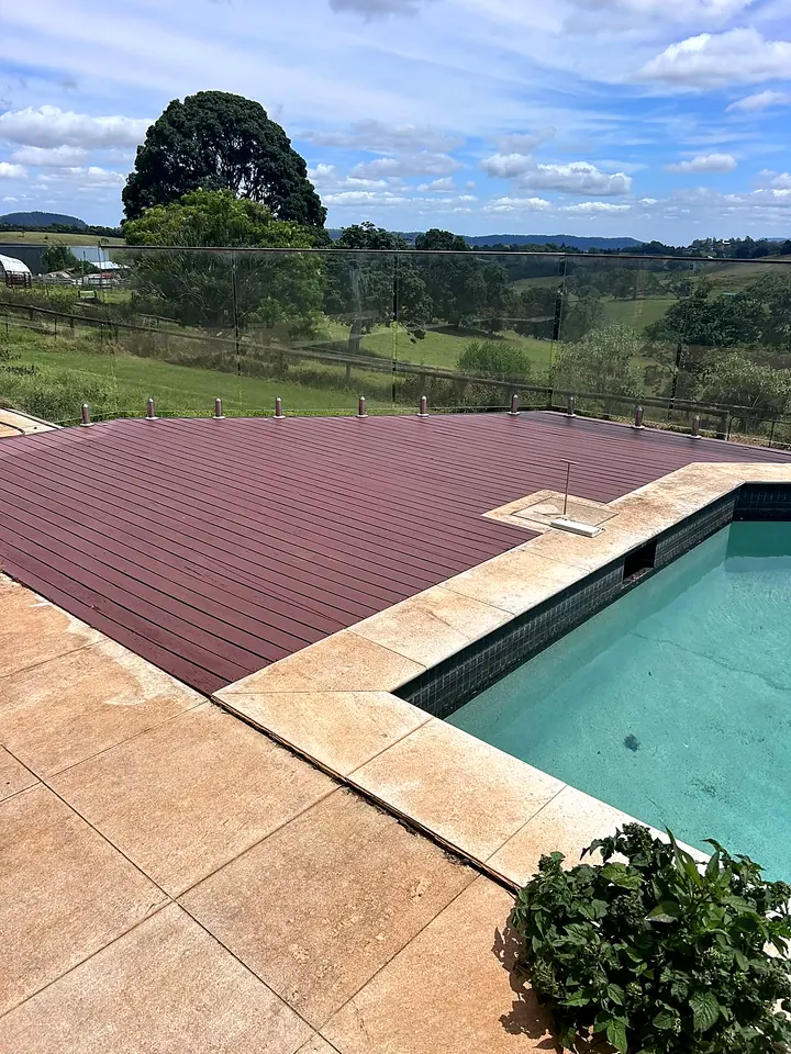 Pool deck refresh with a rural view