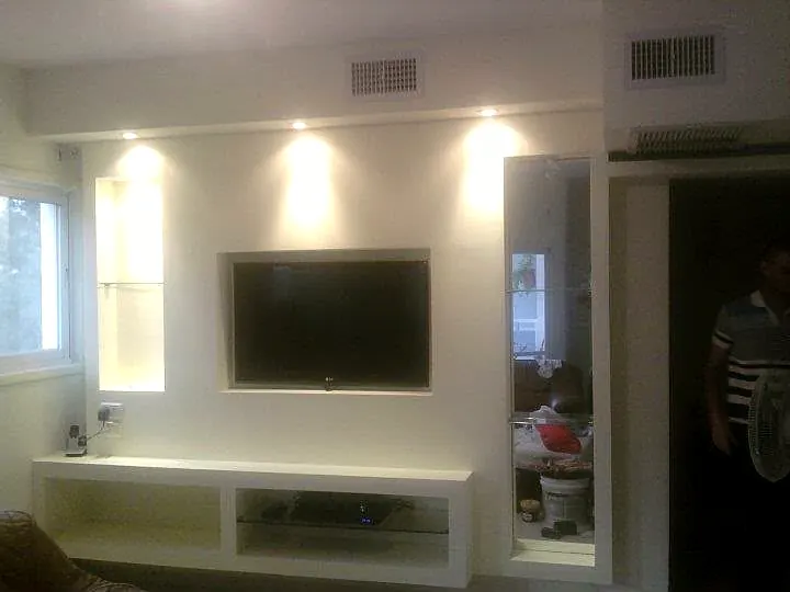 Plasterboard TV wall with lit niches