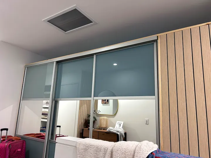 Built-in wardrobe with frosted sliding doors